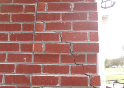 Severe brick cracks on exterior wall due to foundation settlement